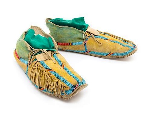 A Pair of Southern Cheyenne Painted Hide Moccasins Length 10 1/2 inches