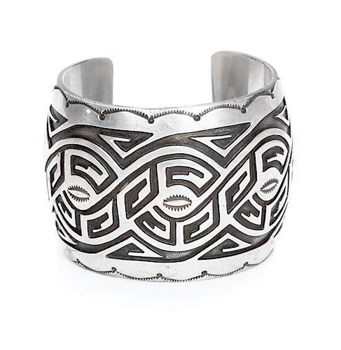 A Hopi Silver Overlay Cuff, Harlan Joseph Length 5 1/4 x opening 1 x width 1 7/8 inches.