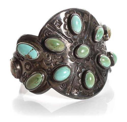 A Navajo Silver and Turquoise Cuff Bracelet Length 5 1/2 x opening 1 1/4 x width 2 1/4 inches.