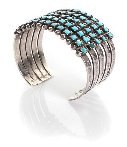 A Navajo Silver and Turquoise Cuff Length 5 1/8 x opening 1 x width 1 3/8 inches.