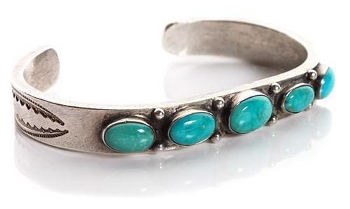 A Navajo Silver and Turquoise Bracelet Length 5 1/2 x opening 1 1/4 x width 3/8 inches.