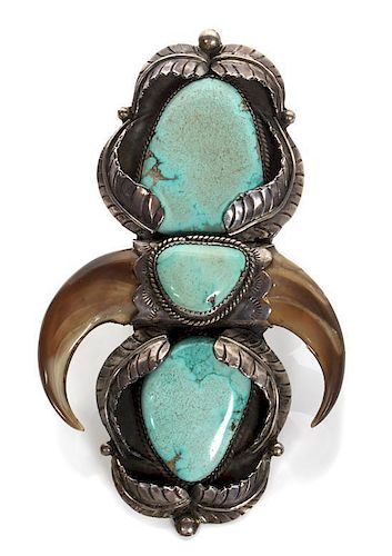 * Two Navajo Silver, Turquoise and Bear Claw Rings Height of larger 4 3/4 x width 2 7/8 inches.