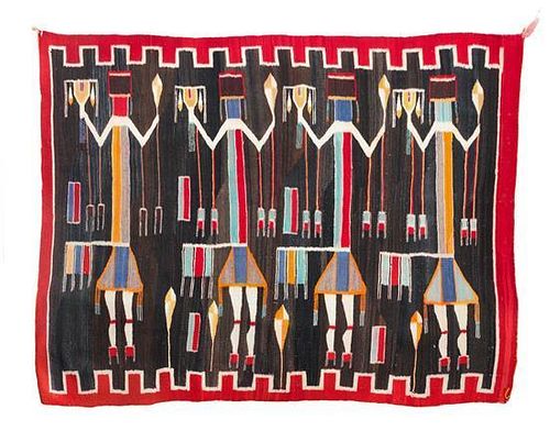 A Navajo Yei Rug 52 1/2 x 77 1/2 inches.