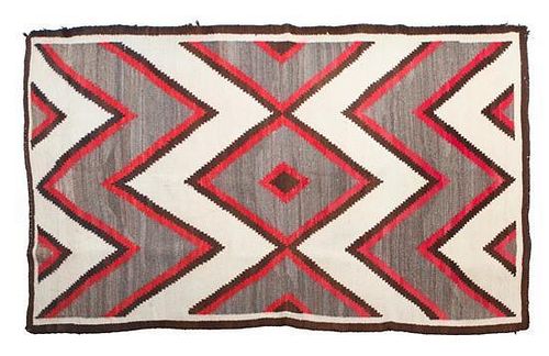 A Navajo Late Transitional Rug 54 1/2 x 77 inches.