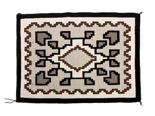 Two Navajo Two Grey Hills Rugs Larger: 43 1/2 x 26 1/2 inches.