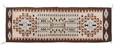 Two Navajo Rugs Largest: 76 x 26 inches.