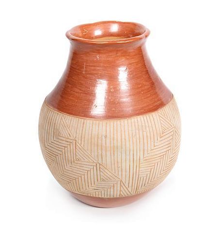 A Santo Domingo Redware Vase Height 10 1/2 inches.