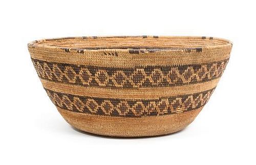A Tulare Basket Bowl Height 4 1/2 x diameter 10 1/4 inches.