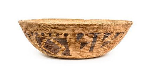 A Mission Indian Basketry Bowl Height 5 1/4 x width 16 1/2 inches.