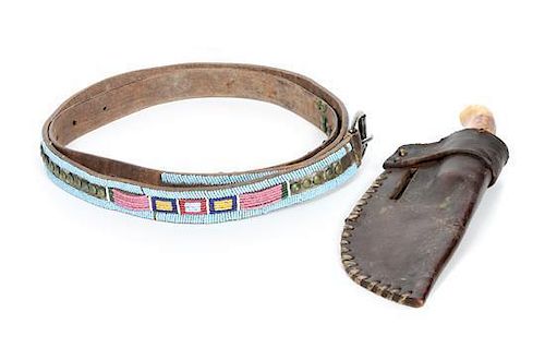 A Crow Style Leather, Beaded and Tacked Panel Belt Length of belt 63 inches.