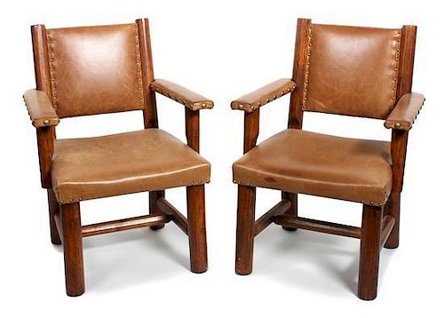 A Pair of Molesworth Style Wood and Leather Arms Chairs Height 35 x length 24 x depth 24 1/2 inches.
