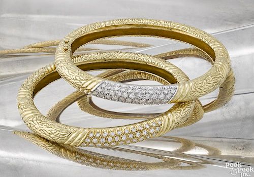 Pair of 18K yellow gold and diamond bracelets