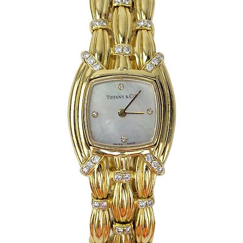 Tiffany & Co 18 Karat Yellow Gold and Diamond Signature Bracelet Watch, Mother of Pearl Dial, Swiss Automatic Movement.