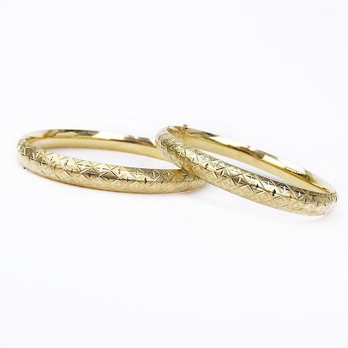 Pair of Vintage 14 Karat Yellow Gold Hinged Bangle Bracelets.