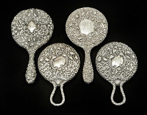 4 Sterling repousse hand mirrors