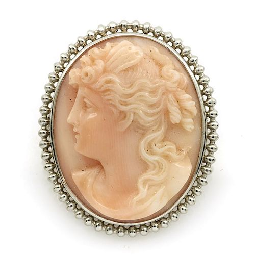 Platinum and coral cameo brooch/pendant.