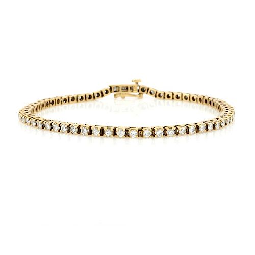 14k Yellow gold and diamond tennis bracelet.