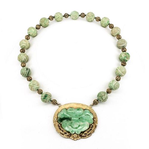 Carved jade and gilt necklace.