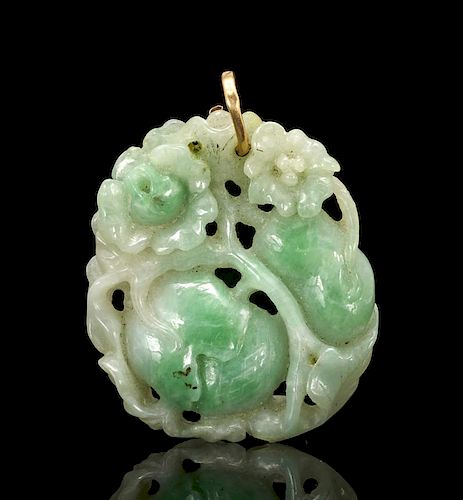 Green jade pendant through carved with flowers and fruit