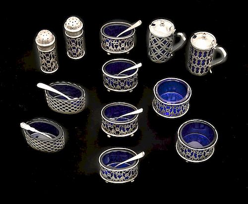 Sterling and cobalt glass salt cellars and pepper shakers