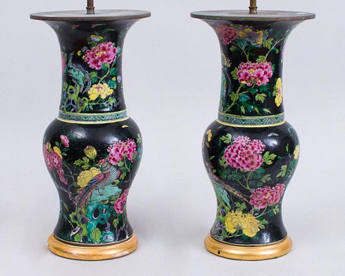 PAIR OF CHINESE BLACK-GROUND FAMILLE ROSE BALUSTER-FORM VASES, MOUNTED AS LAMPS