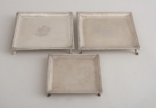PAIR OF GEORGE II ARMORIAL SILVER SQUARE SALVERS AND A MATCHING WAITER