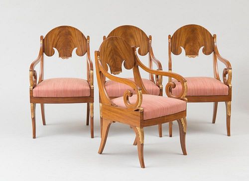 SET OF FOUR RUSSIAN NEOCLASSICAL STYLE MAHOGANY AND PARCEL-GILT ARMCHAIRS