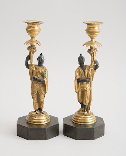 PAIR OF LATE REGENCY BRONZE AND PARCEL-GILT CHINOISERIE FIGURAL CANDLESTICKS