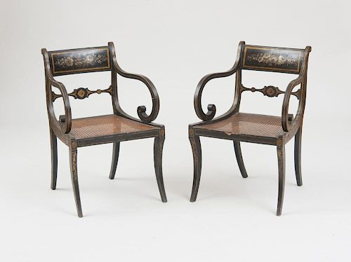 PAIR OF REGENCY BLACK PAINTED AND CANED ARMCHAIRS