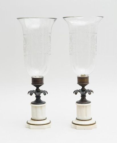 PAIR OF REGENCY BRONZE AND WHITE MARBLE CANDLESTICKS WITH GLASS HURRICANE SHADES