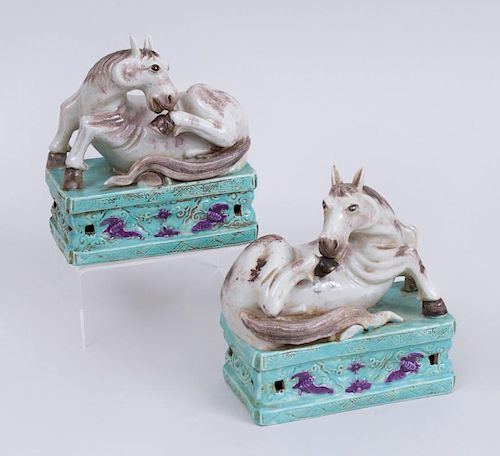 PAIR OF CHINESE EXPORT PORCELAIN FIGURES OF RECUMBENT HORSES