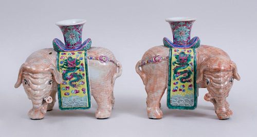 PAIR OF CHINESE EXPORT PORCELAIN FAMILLE ROSE ELEPHANT-FORM CANDLE HOLDERS
