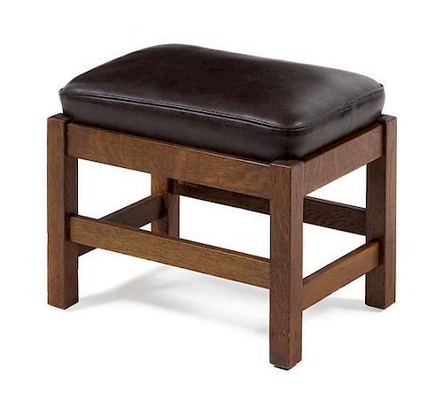 * L. & J.G. Stickley, EARLY 20TH CENTURY, an oak stool, with brown leather cushion