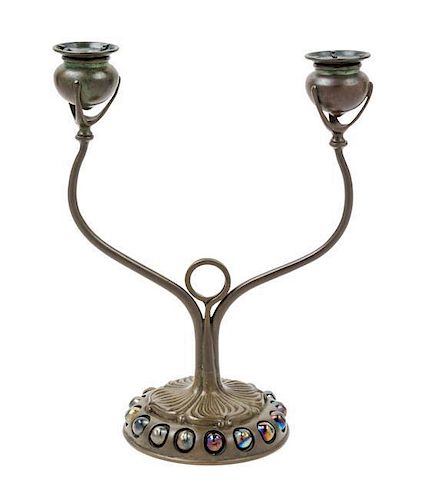* Tiffany Studios, EARLY 20TH CENTURY, a jeweled bronze two-light candelabrum