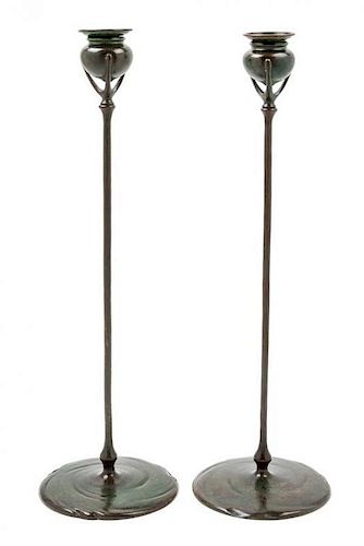 * Tiffany Studios, EARLY 20TH CENTURY, a pair of bronze candlesticks (1213)