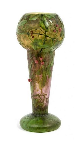 Daum, EARLY 20TH CENTURY, enameled and applied cameo glass vase, of baluster form decorated with berry laden leafy branches,