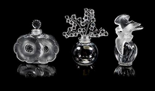 * Lalique, a group of three molded and frosted glass Clairefontaine, Deux Fleurs and L'Air du Temps Fatice perfume bottles