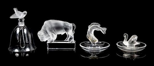 Lalique, a group of four molded and frosted glass articles, comprising a bell, two ring trays, and a figure of a buffalo