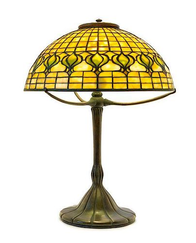 * A Tiffany Studios Favrile Glass and Bronze Pomegranate Lamp, Diameter of shade 14 x height overall 18 1/4 inches.