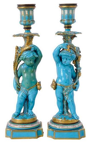 Pair Sevres Style Putti Form Candlesticks