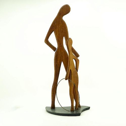 Val Robbins, American (1925-2009) Circa 1950's Carved walnut sculpture "Mother and Son With Hula Hoop".