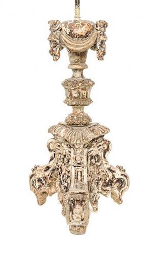 An Italian Baroque Style Painted Pricket Stick Height overall 29 inches.