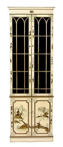 A Regency Style Cream Painted Chinoiserie Bookcase Height 85 1/4 x width 28 x depth 13 inches.