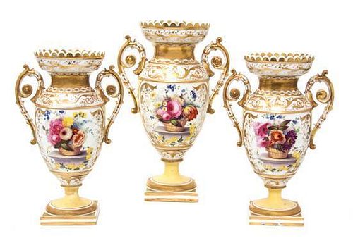 An English Porcelain Three-Piece Garniture Height of tallest 11 inches.