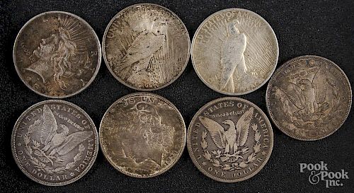 Four Morgan silver dollars