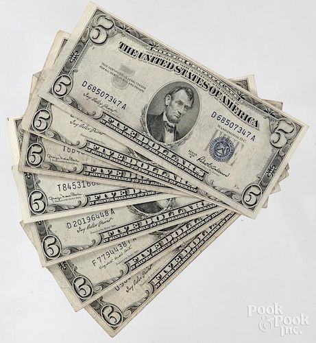 Seven US 1953 five dollar bills.