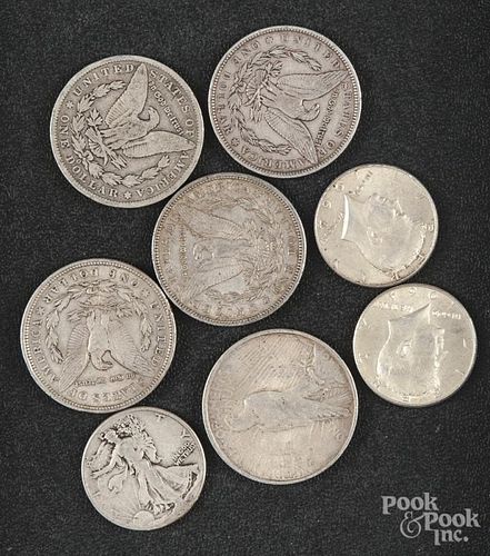 Four Morgan silver dollars