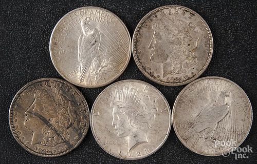 Three Peace silver dollars