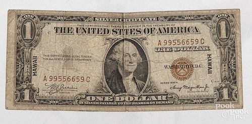 Hawaii series 1935A red seal one dollar bill.