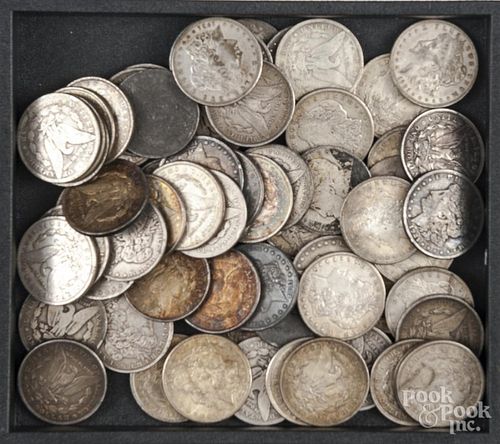 Sixty-six Morgan silver dollars.